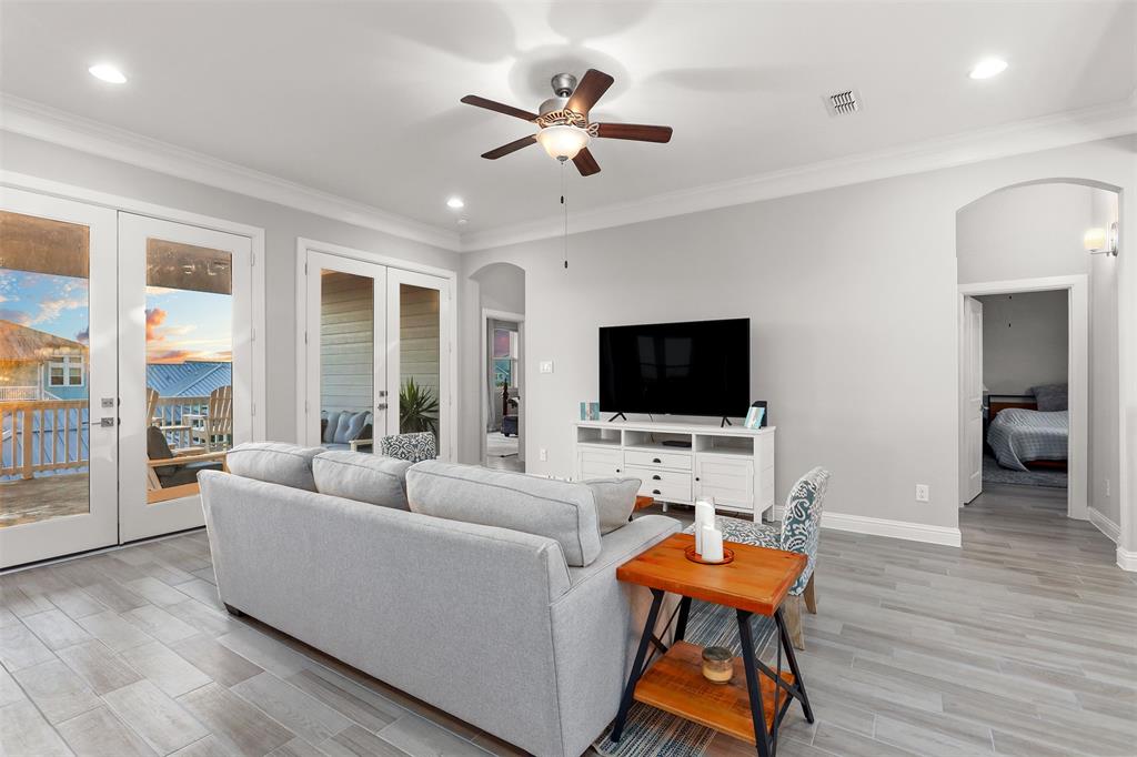 Double French Doors lead to the upstairs balcony.