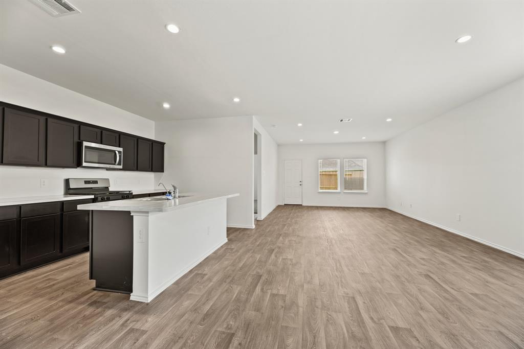 Kitchen opening up to the dining and living room