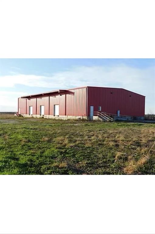 Versatile use is absolutely possible for this 10+ acre property! The barn area is 10,000 sq feet, where 5,000 sq feet is refrigerated. Half of the refrigerated area is a cooler, designed to keep produce products and the other half is a freezer, that can reach sub-zero temperature of -30F. Both refrigerators do not have door guides on the entrance ground of the doors for the easy access by forklifts and pallet jacks. Office space and restrooms on site. Low tax rate.Within minutes from Highway US 59.