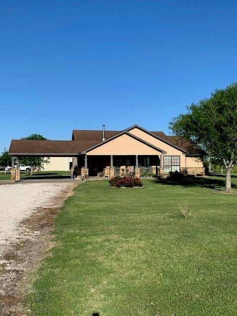 Motivated Seller Will consider contributing funds to buy down rate. SERENE COUNTRY ESCAPE! Bring the family .horses, 4-H projects and/or hobby farm to this wonderful 3 bedroom, 2 bath home. Situated on 10 acres of native pastureland. Fully fenced with electric gate entrance. Currently 8 of the 10 acres are being used for hay production and listed as AG Exempt with the CAD. Conveniently located just 2 miles from I-69 and less than an hour commute to Sugarland or Victoria! Kitchen has granite countertops and stainless-steel appliances. Tile and wood flooring throughout home. Recessed lighting throughout, large closet spaces, extra large laundry room area, and a wood burning stove for those extra cold winter nights! Property includes a 30x60 ft shop with 12x12 roll up doors, walk doors, cooking area, 6x12 climate-controlled office/storage area, and 6x12 bathroom with shower. Water well/garden shed on slab, 12x12 ft dirt floor shed that is fenced for animals. Plus, fruit trees and a garden
