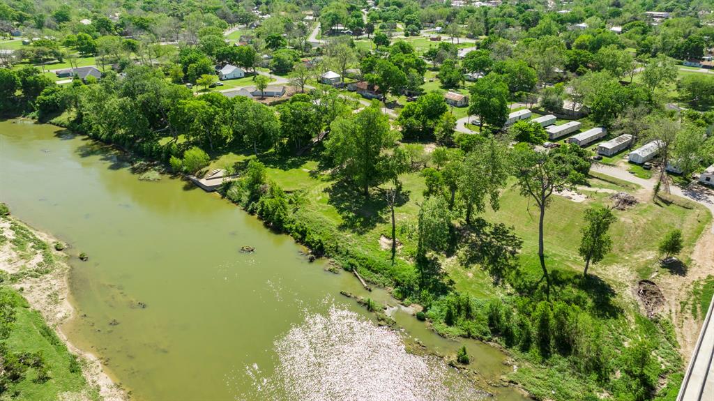 This property is one of very few riverfront properties in Columbus, Tx that is zoned commercial. It offers approximately 300 feet of Colorado River frontage. If commercial is not what you are looking for, the property can also be used for a residential homestead. The property sits in both the city limits and outside the city limits but has city amentities such as utilities and road maintenance. Prior structures have been removed, making it a blank canvas for your building plans. You will find Zone AE along the waterway but the front of the property is in Zone X making it an ideal building site. To make the property even more unique, it is rich in history being the previous homesite of "Robson's Castle" with a historical marker on site. The neighboring property can also be purchased.