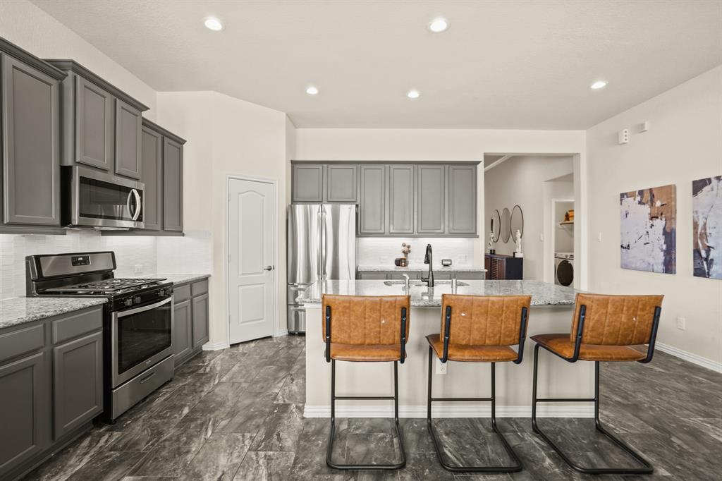 With both upper and lower cabinetry, plus a large center island with storage and generous walk-in pantry, you will never run out of storage or prep space in this dream kitchen!