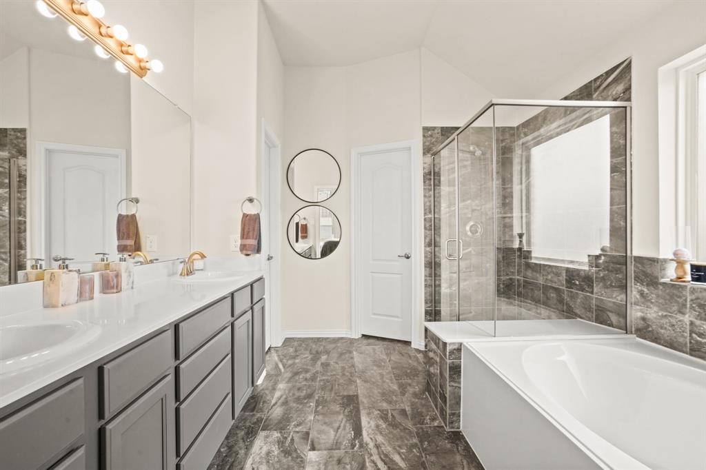 Skip the spa and retreat to your dazzling en-suite bathroom. Adorned with dual sinks and designer fixtures, it\'s the epitome of elegance and luxury.