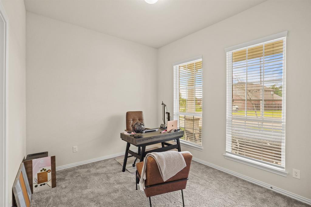 The second bedroom is bright and spacious with cozy carpet and front yard views. This would also make an ideal home office space, play room, or whatever else meets your personal needs.