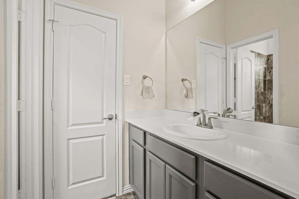 The Hollywood bathroom was thoughtfully designed for sharing with its generous counter/cabinet space, and versatile tub/shower combo separated behind a door.