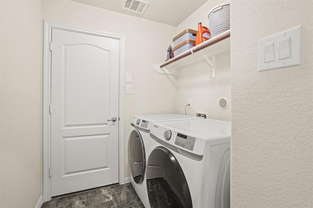 From laundry essentials to household necessities, efficiency meets organization in this utility room equipped with storage solutions.