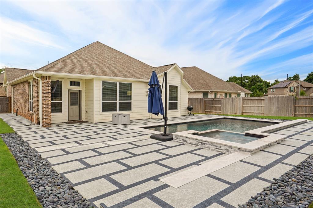 Embrace resort-style living right in your own backyard with this impressive heated pool and spa, surrounded by decking for ample outdoor entertaining and alfresco dining space.