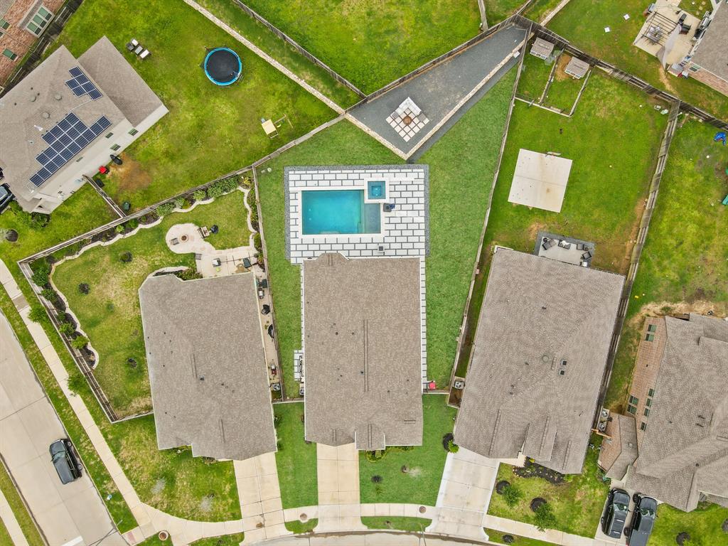 Enjoy an aerial view of the 1,966sf floor plan and 11,373sf lot. Make your appointment to see it in person!