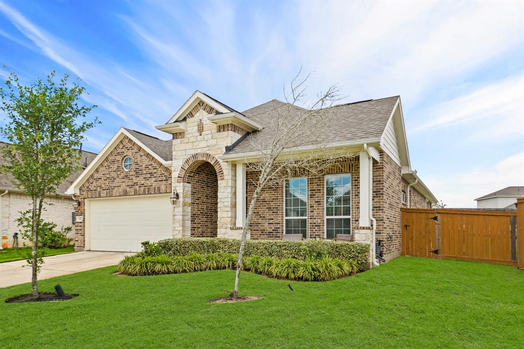 Prepare to be captivated by the picturesque curb appeal of this home, showcasing a blend of brick and stone elevation, complemented by meticulously manicured landscaping.