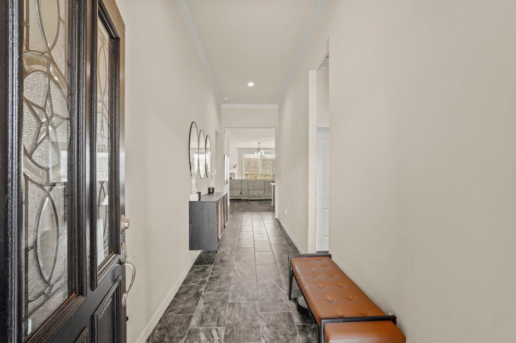 Step inside the welcoming foyer to be greeted by beautiful tile floors effortlessly spanning to the back of the home. This home also features a pre-wired alarm for added peace of mind.