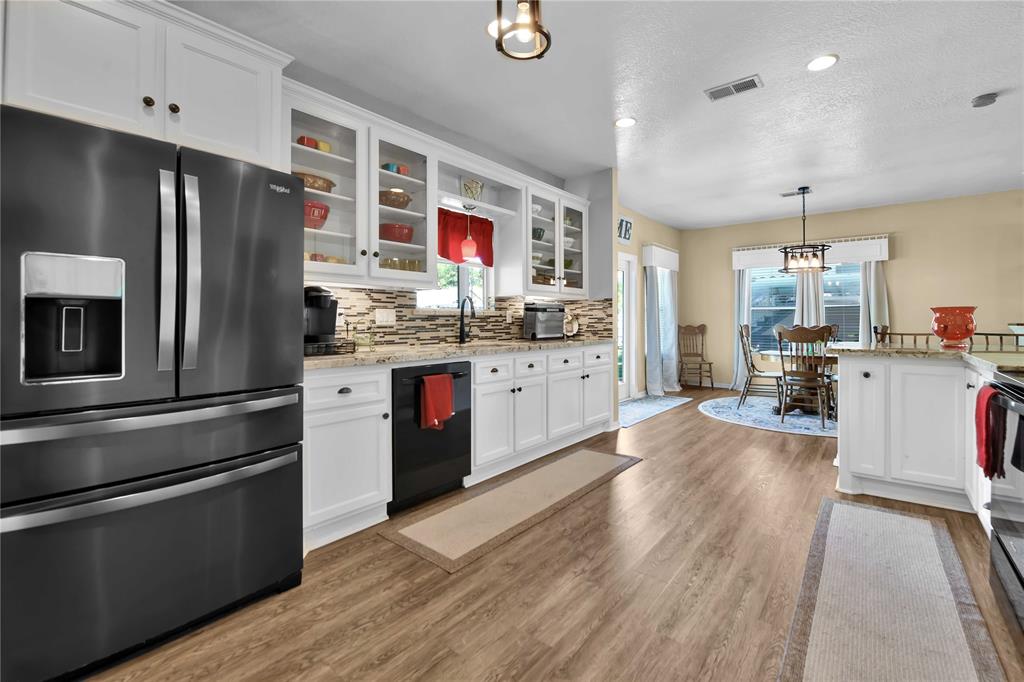 View of kitchen looking in dining area.