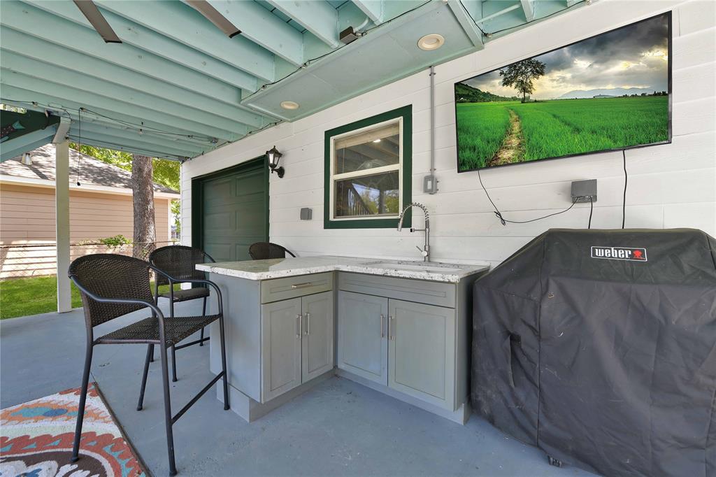 Patio has built-in sink for cooking and entertaining.