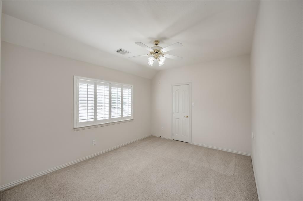 One of four OVERSIZED secondary bedrooms located on the second floor of this home. All bedrooms feature walk-in closets, lighted ceiling fans, and large windows with plantation shutters.