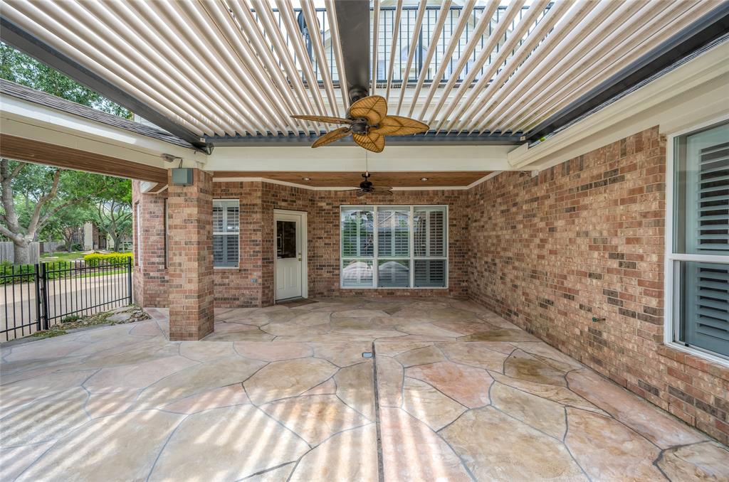 Enjoy the outdoors in all weather in the spacious covered patio area featuring durable, long-lasting cedar ceiling with recessed lighting. Ceiling fans keep the patio cool during hot Texas summers.