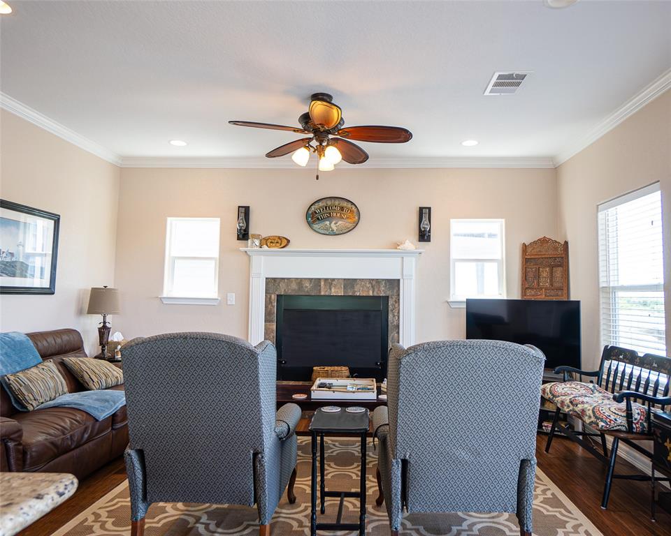 Living room has a wood burning fireplace and has large windows and a view to the Colorado river.