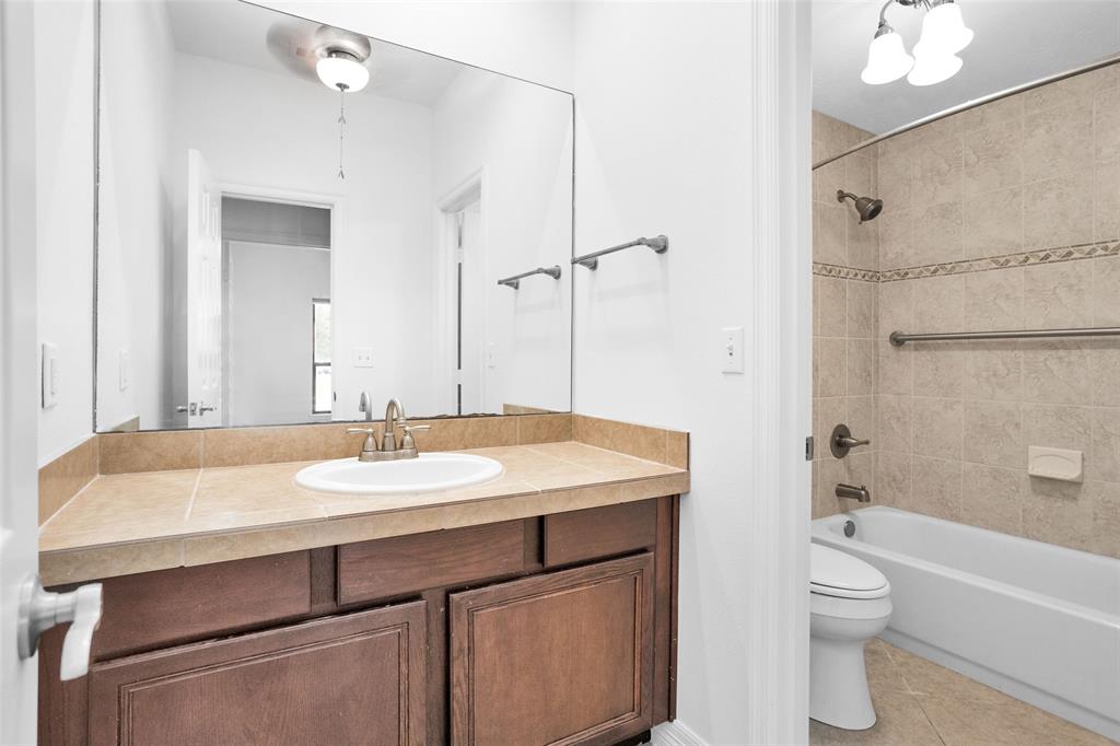 Adorable First Floor Full Bathroom w/ a separate tub/toilet area perfect for family & guests.