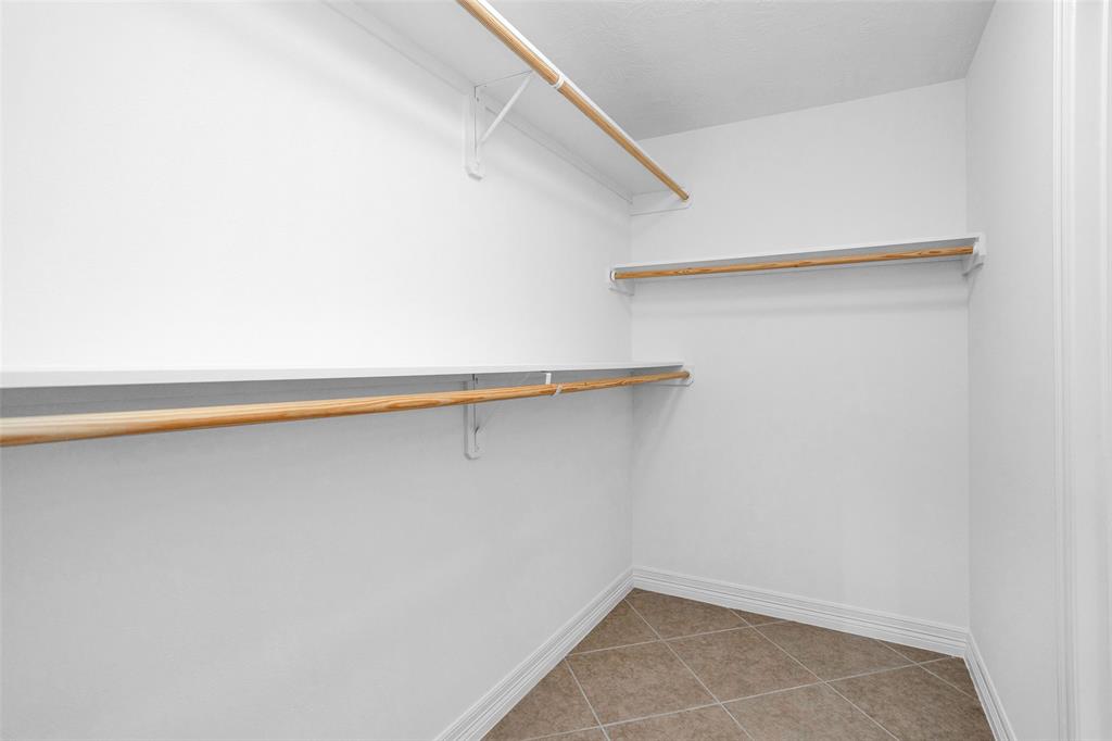 Primary walk-in closet offers an unbelievable amount of storage space.