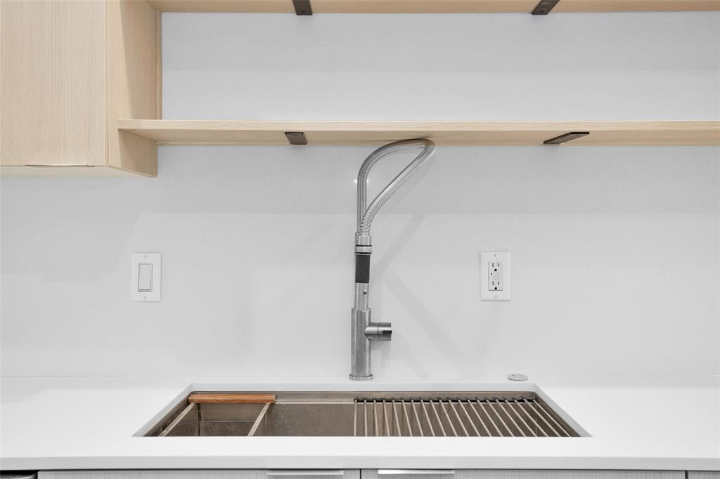 Updated oversized Kitchen sink with full-service prep station & gooseneck faucet making meal prepping a breeze.