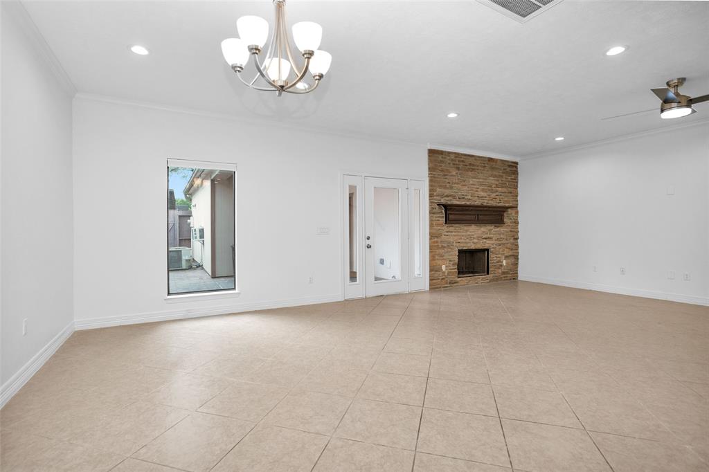 Spacious Breakfast/Dining Room offers recessed lights, chandelier, lots of natural light, & opens to the Family Room.