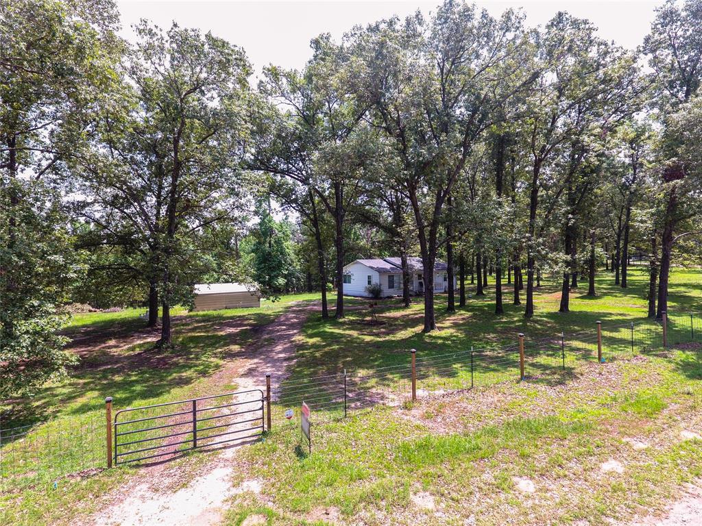 Entrance of the property. The entire property is fenced in.