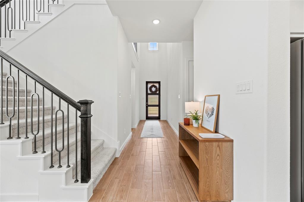 An alternate view of the gorgeous front foyer, with beautiful easy care tile flooring.