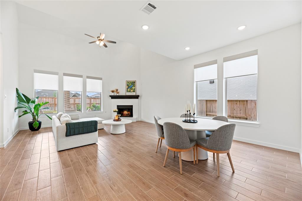 This chic living room space has a great feel with tons of natural light coming from all the windows.