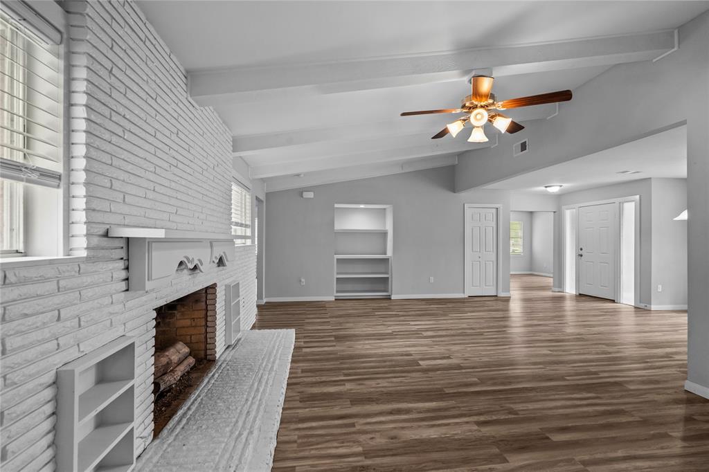 Another great view of the living looking towards the built in bookshelves.