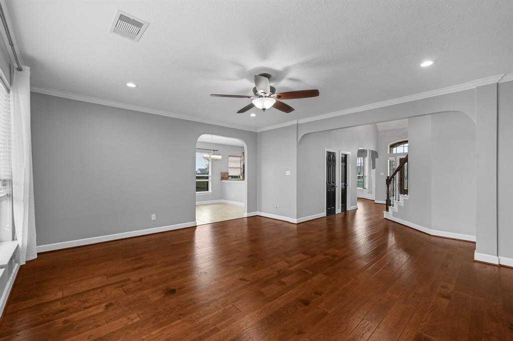 Spacious and bright living area with gorgeous views of the backyard oasis.