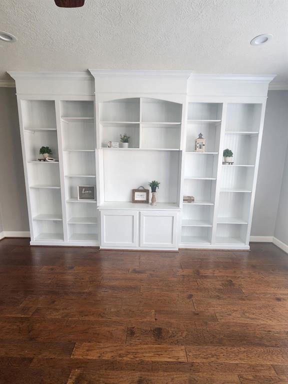 Living room shelving has been painted white.