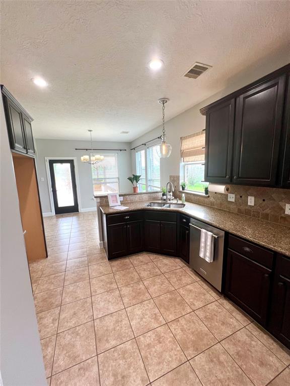 Kitchen is accessible by formal dining and breakfast room.