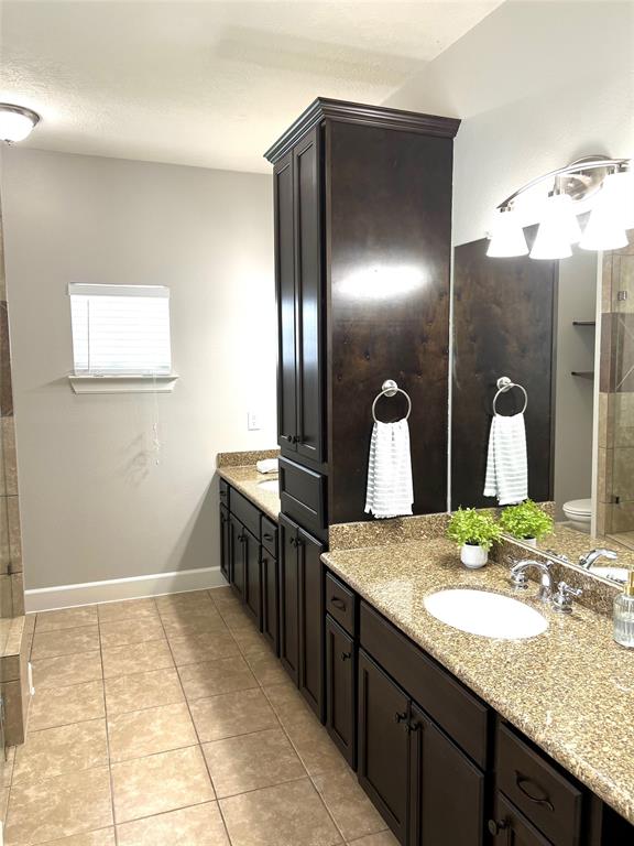 Updated primary bathroom with double vanities and fresh new paint.