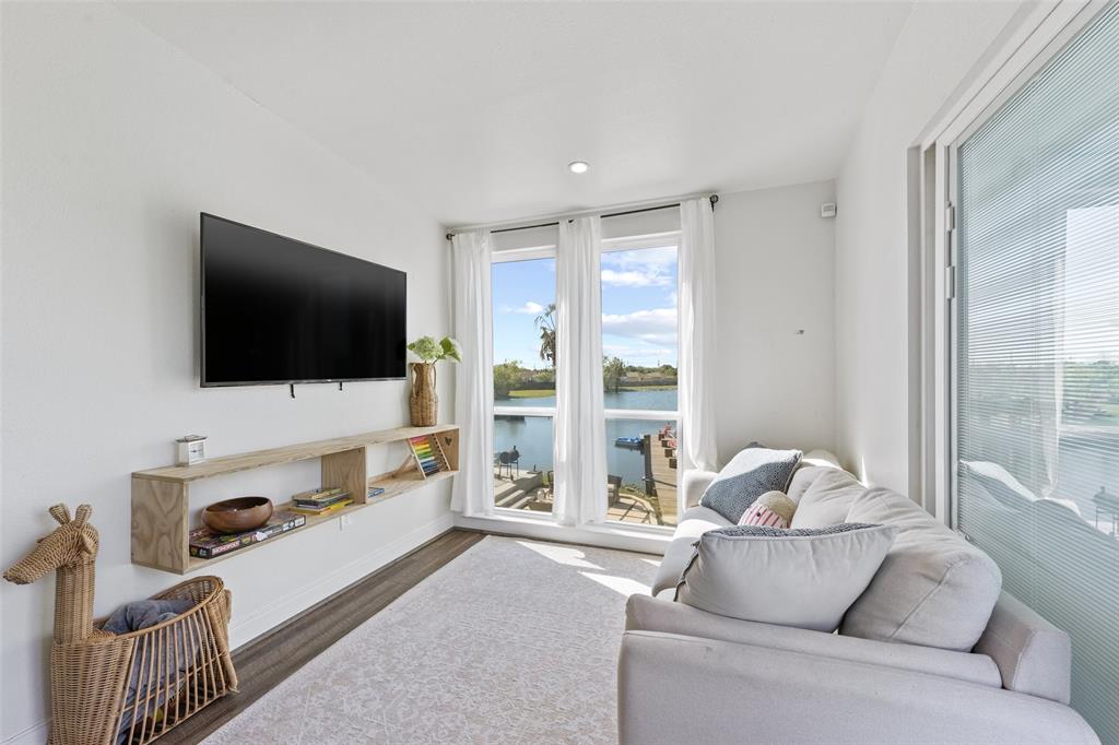 The living area of the guest house offers a waterfront view of the lake.