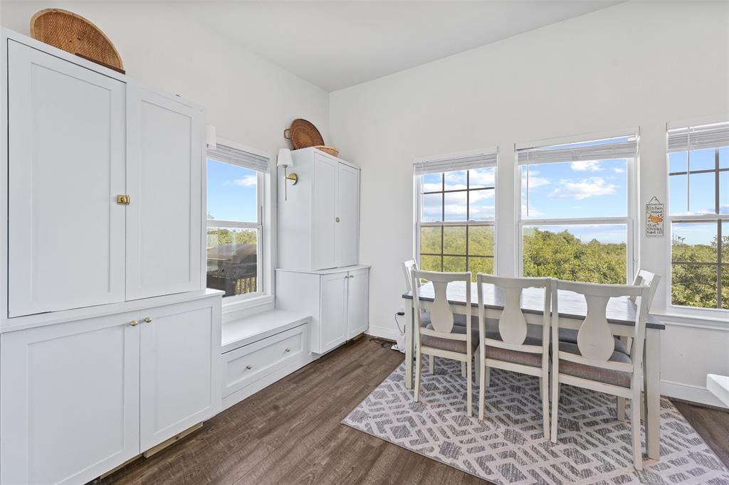 Gorgeous breakfast nook with storage cabinets and a waterfront view overlooking Galveston Bay.