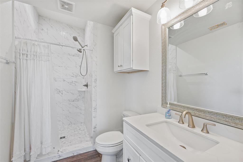 A freshly updated bathroom with quartz countertops for a revitalizing experience.