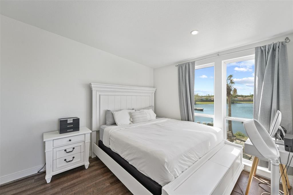 The primary bedroom offers a serene retreat with a peaceful view of the lake whether you\'re unwinding after a long day or starting your morning refreshed.