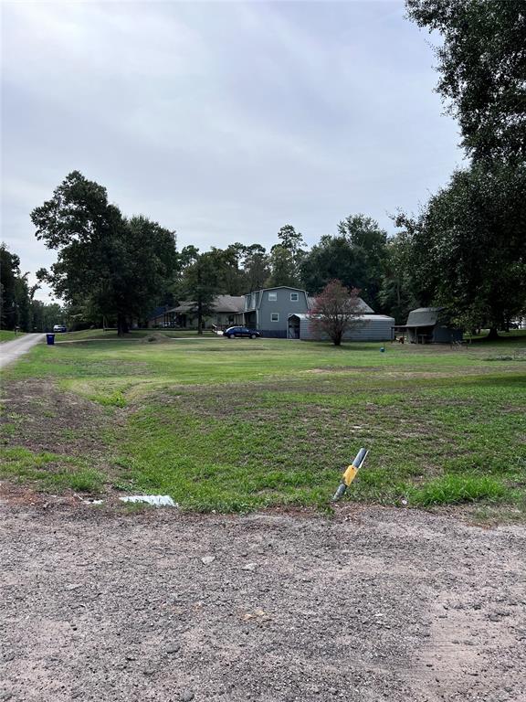 END OF LOT ON CORNER LOOKING UP TO HOUSE