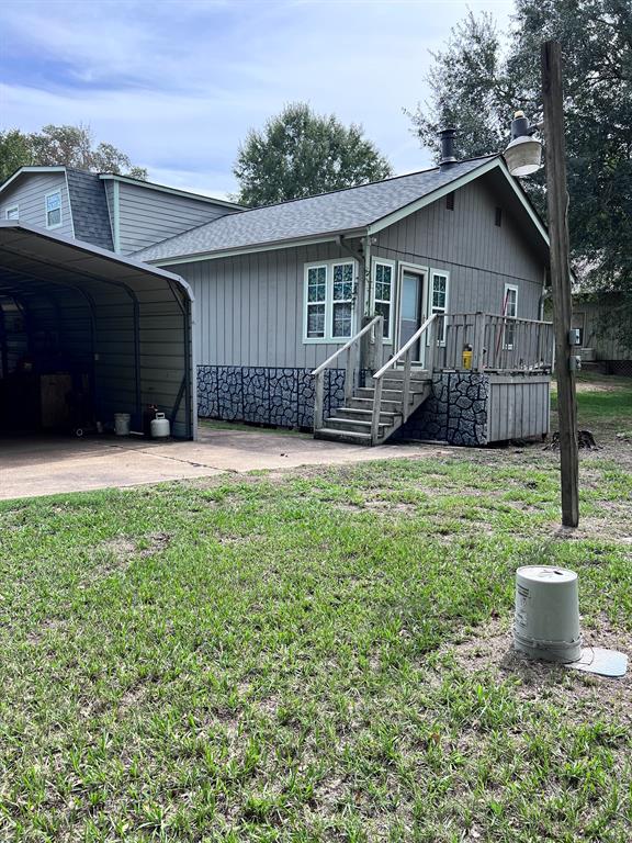 BACK OF HOUSE AND CARPORT