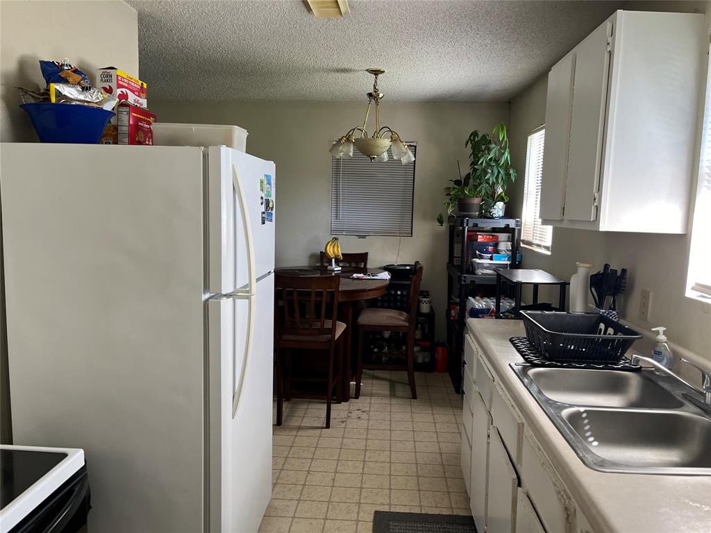 View from laundry through kitchen to dining room area.