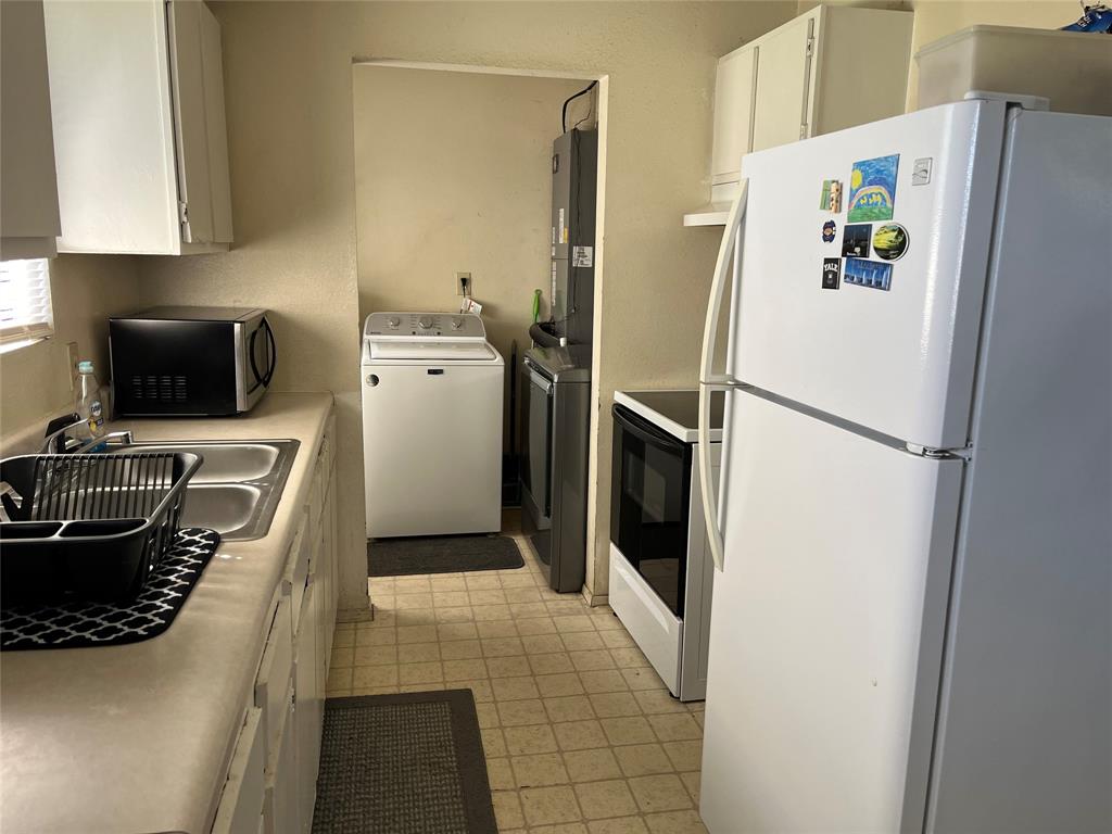 View from dining room area through kitchen to laundry.