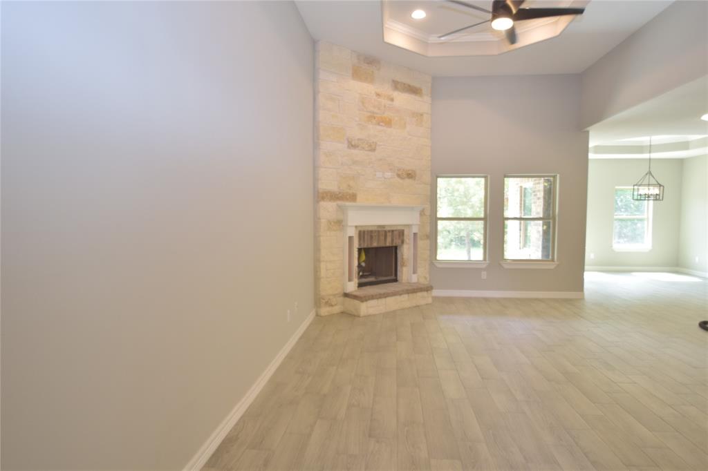 FLOOR TO CEILING STONE AROUND THE FIREPLACE