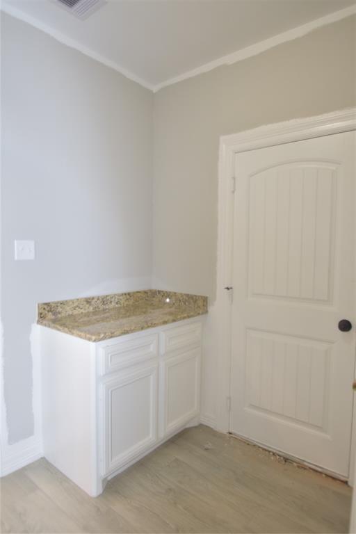 PART OF THE LAUNDRY ROOM BETWEEN THE GARAGE AND KITCHEN