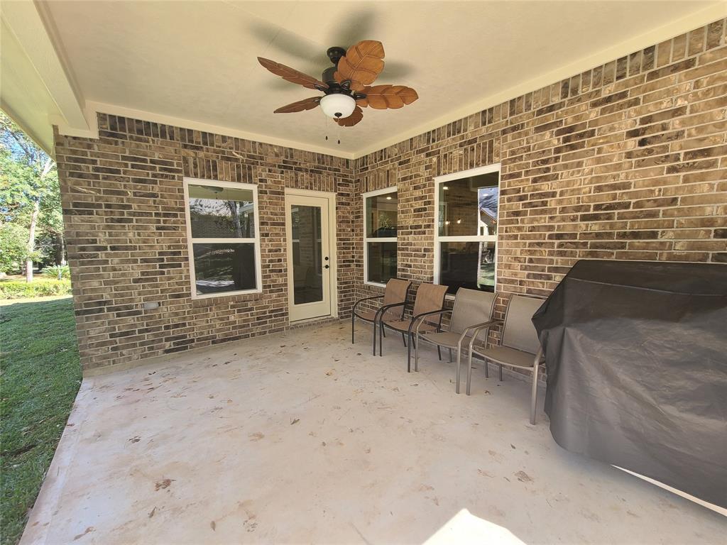 Sample of back covered patio all brick with ceiling fan and TV connections