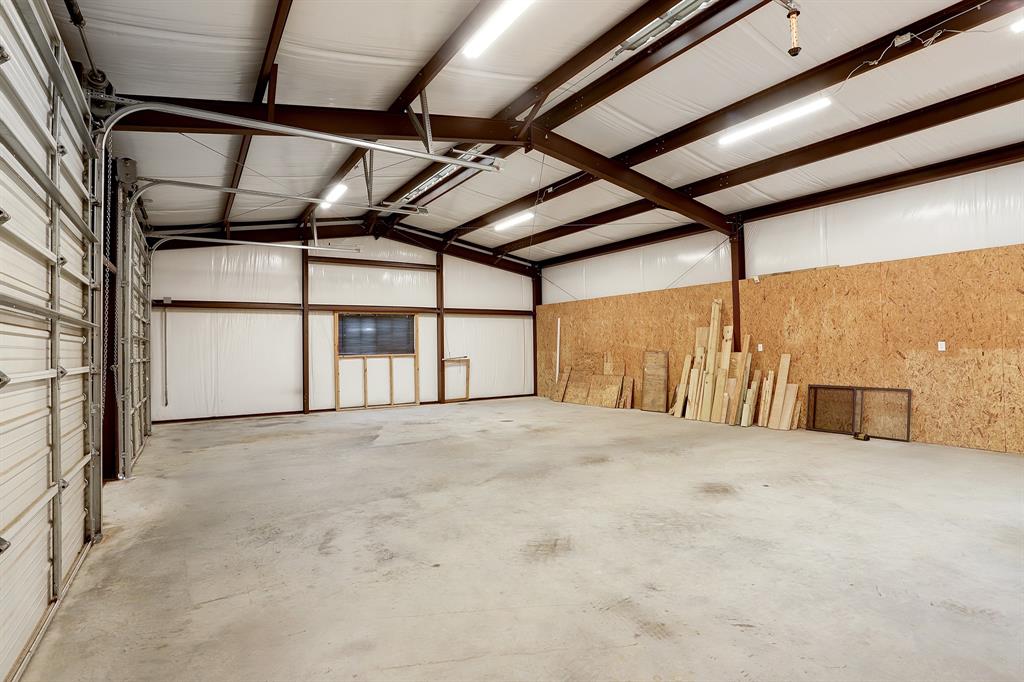 Well laid out 1200sf shop, complete with insulation to regulate temperature. Featuring 2 roll up doors, this space offers easy access for equipment, workshop, or partyroom.