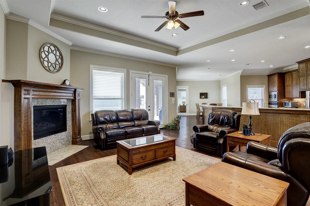 Gorgeous living space with coffered ceilings and crown molding.