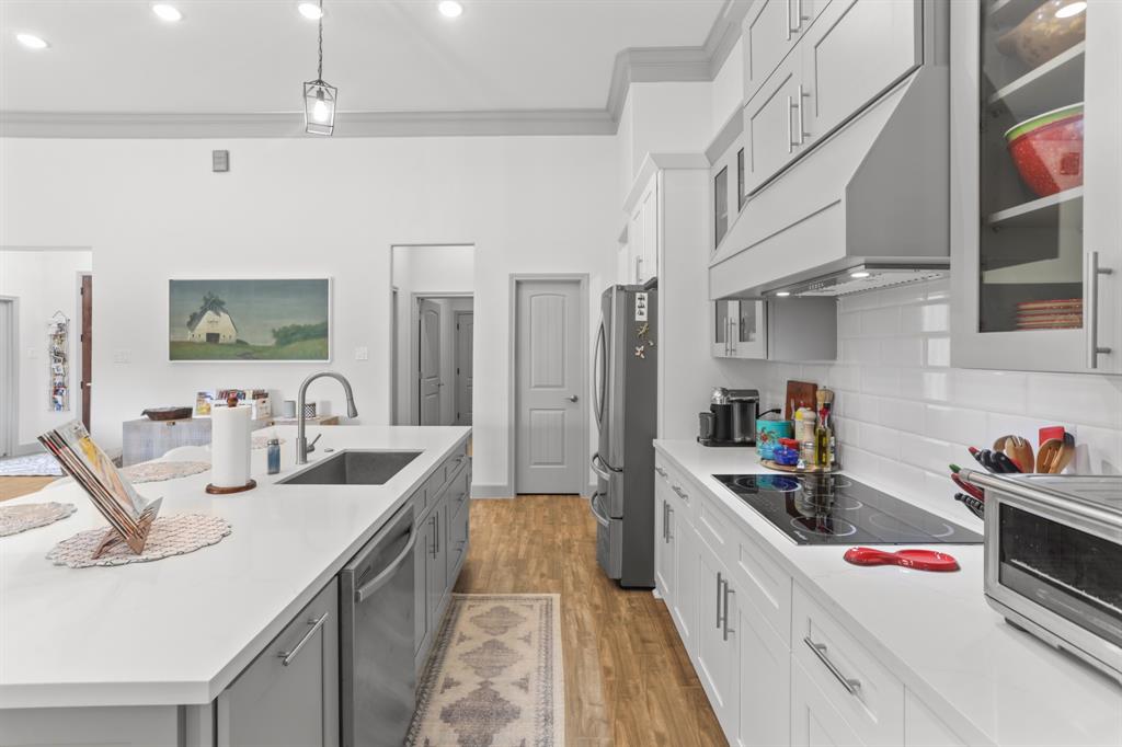 View of kitchen leading to the Laundry Room and Pantry.