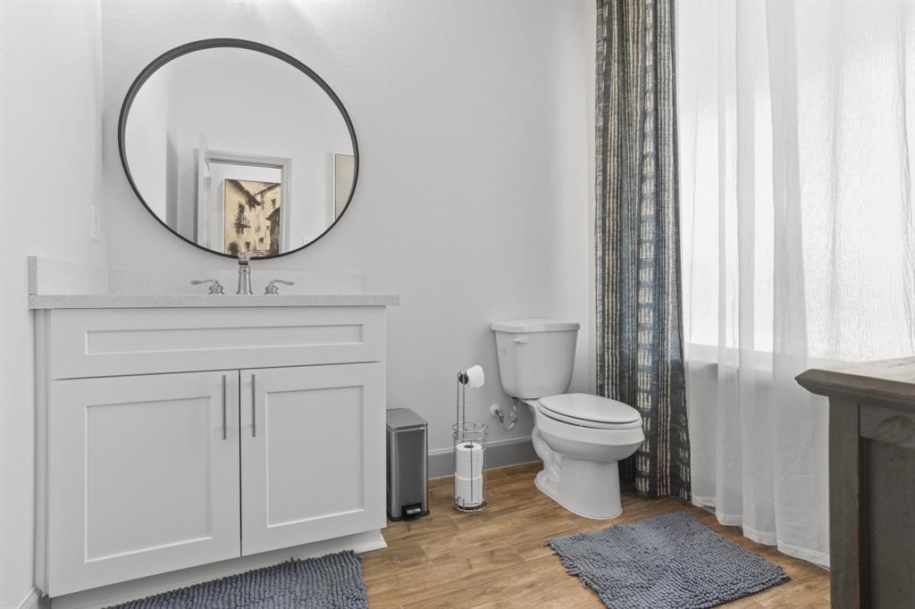 Here is the cozy half bathroom by the kitchen and the laundry room.