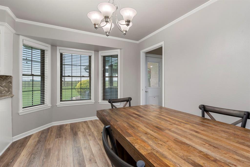 The breakfast area is the perfect place to relax and enjoy that morning cup of coffee. The door leads to the expansive outdoor patio.