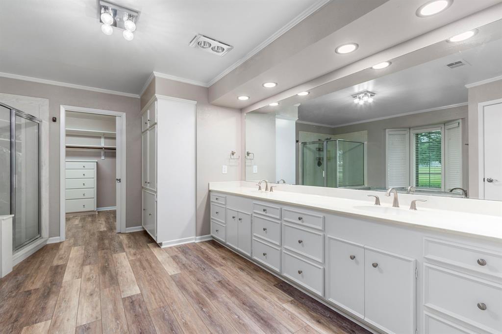 Luxurious spa like bath features dual sinks, large soaking tub and large shower.