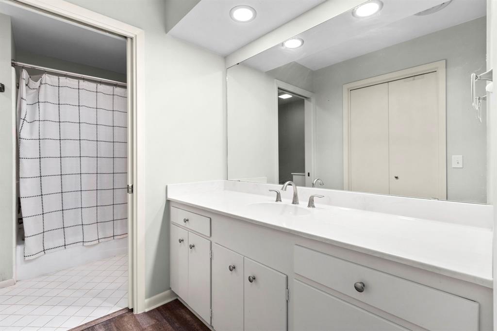 Beautifully updated hall bath with tub shower combination.