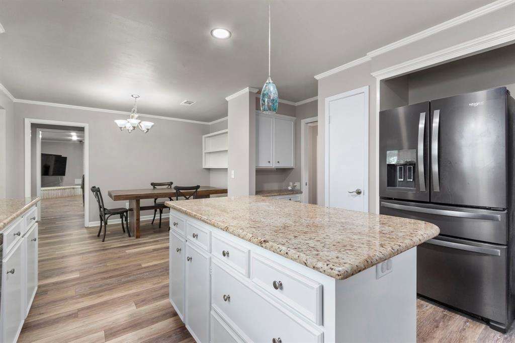 The spacious open floor plan allows you to stay in touch with guests while entertaining. Straight ahead is the great room and to the right the formal dining room. Did I mention this gorgeous kitchen features 3 pantries?